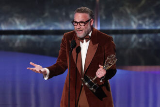Seth Rogen holds the Outstanding Lead Actor in a Comedy Series award for The Studio onstage during the 77th Primetime Emmy Awards at the Peacock Theatre at LA Live in Los Angeles on September 14, 2025
