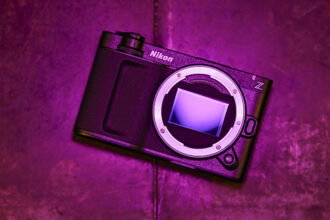 Nikon ZR camera, no lens, under low key magenta lighting