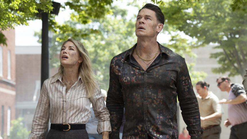 Emilia Harcourt #2 and Chris Smith #1 looking up in Peacemaker season 2 episode 3