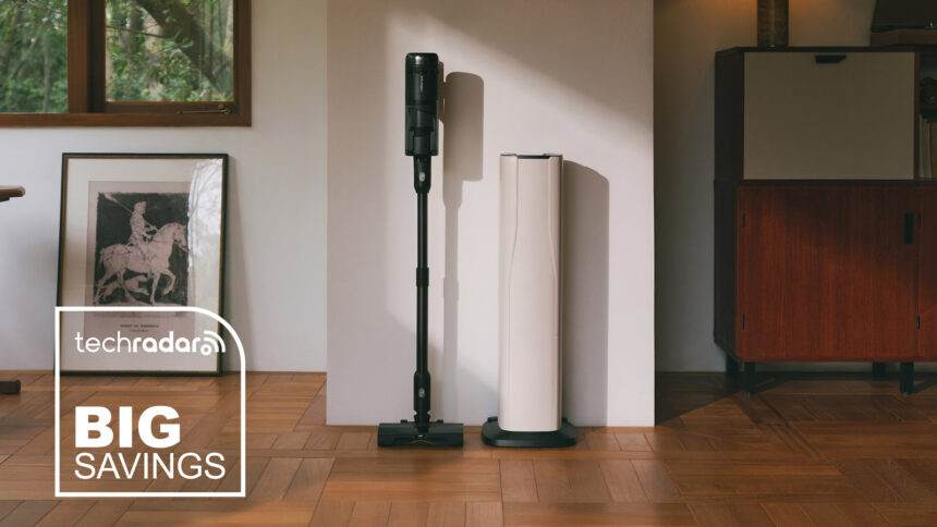 Roborock H60 Hub Ultra stick vacuum cleaner standing against a wall, next to its docking station.