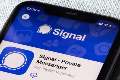 A smartphone on a table showing the Signal app