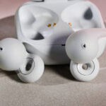 Sony LinkBuds Open buds next to charging case