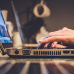 person typing on laptop