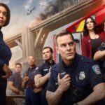 The cast of 9-1-1 assemble by a fire truck and a burning bridge