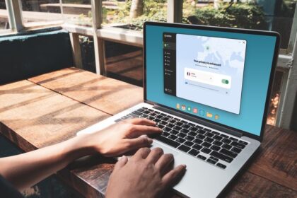 A person using a laptop with Norton VPN activated.