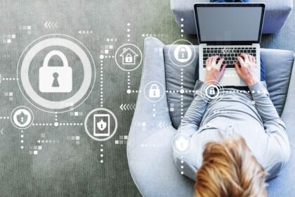 A padlock icon next to a person working on a laptop.