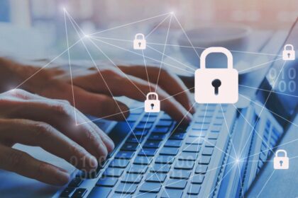 Hands typing on a keyboard surrounded by security icons