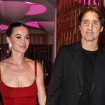 Katy Perry and Justin Trudeau walking hand-in-hand in Paris, smiling and enjoying a public outing together.