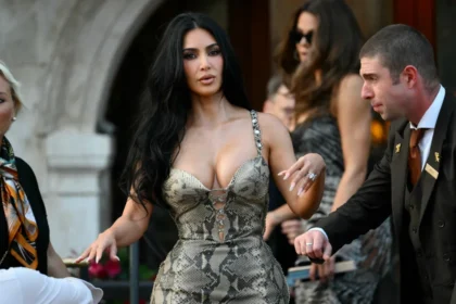 Kim Kardashian leaving her hotel in a low-cut designer dress after making headlines for her moon landing comments.