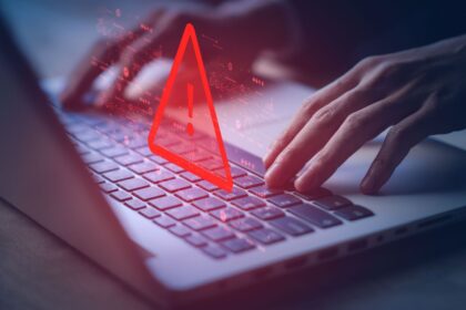 Laptop with warning symbols over the keyboard