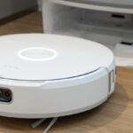 Narwal Flow robot vacuum next to its base