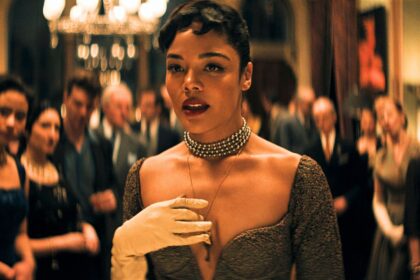 Tessa Thompson walks through a crowded dancefloor