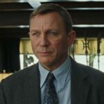 Daniel Craig looks past the camera
