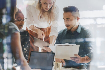 business people working with a digital tablet in a meeting
