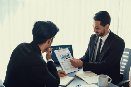 Financial advisor presenting charts and investment data to a client during a consultation