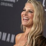 Ali Larter smiling on the red carpet at Landman TV series premiere.