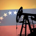 Oil well pumping crude with the Venezuelan flag in the background, symbolising the country’s vast oil reserves and energy wealth